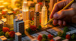 © ★★★★★ - Hand with pencil over a detailed miniature city model. Architect planning an urban metropolitan layout with glowing skyscrapers. Real estate development and smart city concept.