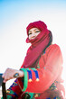 © Cavan Images - portrait of woman wearing a turban in the Sahara desert
