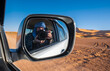 © Cavan Images - Photographer takes a 'selfie' while driving through the Sahara