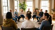 © Panlop - Group therapy session with a counselor discussing mental health and wellness in a bright room.