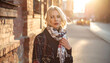 © Rama - Blonde woman in a sequined jacket and scarf on a city street at sunset, golden hour light, bokeh background