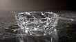 © naevermillion - Elegant clear glass crystal ashtray on a dark textured surface.