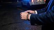 © Katawut - Executive in Handcuffs Facing Arrest in Luxury Suit During Nighttime Encounter