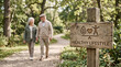 © FrameLab - Happy Senior Couple Walking on Nature Trail Behind a Wooden Healthy Lifestyle Sign Illustrating Wellness and Active Retirement