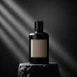 © Anumedha - luxury black perfume bottle on rugged stone pedestal with dramatic backlighting and soft particles