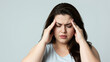 © CrazyJuke - Migraine agony: a woman clutches her head in pain, eyes squeezed shut, face etched with the discomfort of a debilitating headache.