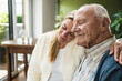 © Westend61 - Woman embracing and taking care of father at home