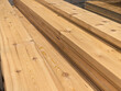 © Vertstyle - Long Wooden Boards Stacked in Hardware Store