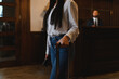 © Serhii - Woman traveling arriving hotel lobby with suitcase