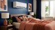 © Megin Design - Woman sleeping in bedroom with wall mounted air conditioner. Split system unit cooling room at night. Home comfort and climate control