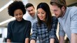 © Thares2020 - Three diverse professionals are engaged in collaborative strategic planning within a bright modern office environment