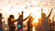 © tashechka - People celebrate with confetti during sunset at an outdoor event in a park