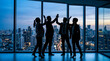 © sajibul35 - Business team celebrating success with high fives in a modern office at sunset
