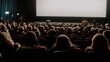 © tashechka - Many people watch a film in a large theater during the evening show