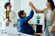 © Julia - Business colleagues celebrate success with a high five