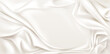 © vectorpouch - White cream gradient background with luxurious silk texture and elegant pearl tones. Abstract grey fabric waves - soft patterns for cosmetic beauty products and studio design layouts.