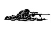 © Babut - Soldier aiming sniper rifle in camouflage lying on ground.
