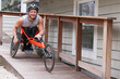 © Connect Images - Man with spinal cord injury in disability racing bike