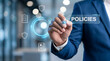 © HADI INCREDIBLE - Businessman interacting with digital interface showing policies and corporate compliance icons in a modern office environment