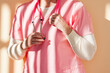 © Connect Images - Mid section view of a nurse with a stethoscope