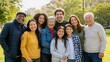 © Tati - Smiling multigenerational diverse family group outdoors in a sunny park