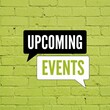 © REBA  - Upcoming events text in speech bubbles on a bright lime green painted brick wall background texture