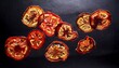 © Cristina - dehydrated tomato slices levitating against a dark backdrop creating a visually appealing pattern