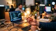 © Tantri - Hand Holding Illuminated Light Bulb in Creative Workspace