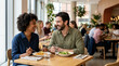 © Xenia - Happy mixed race couple eating lunch and laughing in a restaurant. Smiling Black woman and Caucasian man on a dining date