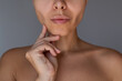 © Марина Демешко - Close up of young woman's lower face showing sculpted jawline and slimmer cheeks after buccal fat removal surgery. Aesthetic plastic surgery result concept
