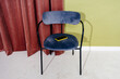 © Sergey Narevskih/Stocksy - Smartphone Left on Upholstered Chair in Modern Interior