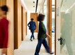 © Boris Jovanovic/Stocksy - Business people on the move through the corporate space