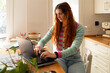 © Alba Vitta Studio/Stocksy - Woman Works on Laptop at Home