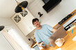 © Alba Vitta Studio/Stocksy - Man Works From Home in Kitchen on Laptop Headphones