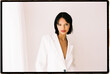 © Tania Cervian/Stocksy - Woman wearing white blazer
