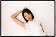 © Tania Cervian/Stocksy - Young woman posing in white lace top