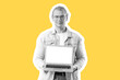 © Pixel-Shot - Young man with blank laptop on yellow background