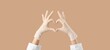 © Pixel-Shot - Medical professional hands in protective gloves forming heart shape, healthcare and wellness support concept, this gesture represents gratitude and solidarity within the medical community