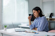 © Phimwilai - Professional woman thinking, concentrating on difficult work problem