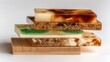 © Wong - Stacked composite material samples showcasing diverse textures and colors in a studio setting