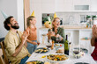 © Westend61 - Family celebrating birthday with cake and laughter at home