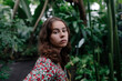 © Westend61 - Portrait of female teenager in Botanical Garden