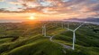 © Faruk - Onshore Wind Turbines in Green Landscape at Sunset for Renewable Energy