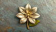 © fitri - Ornate golden flower brooch with green leaf detail on textured dark background, vintage accessory