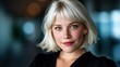 © Larisa AI - A close-up portrait of a confident young woman with blonde short hair, radiating elegance and strength in a modern interior setting, showcasing beauty and self-assurance.