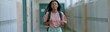 © Andrii Zastrozhnov - Teen girl walking in school hallway with backpack for education background and student lifestyle banner