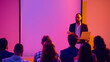 © Lustre Art Group  - Businessman presenting with laptop in front of audience and blank screen. Concept of corporate seminar, workshop training, business education, leadership development and communication skills.