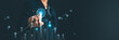© flyalone - Businessman pointing at growing virtual bar chart graph and hologram target. Business strategy development, planning, financial analysis, corporate success and goals achievement concept
