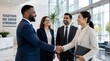 © Almariz - Diverse business professionals shaking hands in modern office lobby