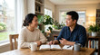 © Marina - Engaging discussion about bible reading with two people at home over coffee. Bible reading session features open book on wooden table with warm atmosphere and house plants enhancing comfort.